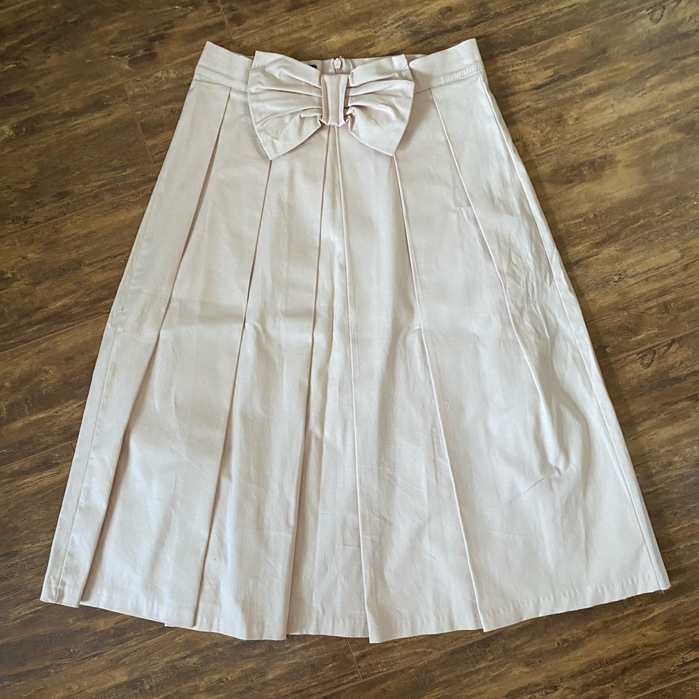 Pale Pink femme de carriere full pleated skirt with bow